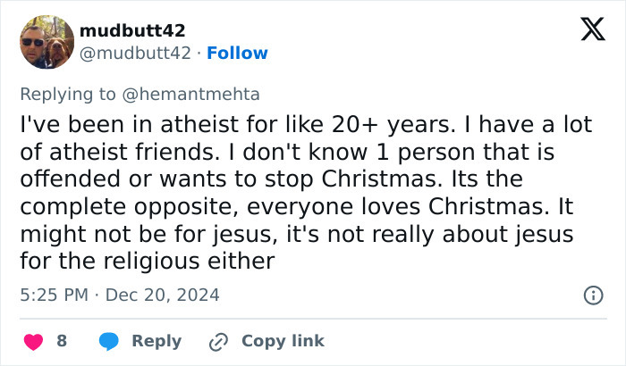 Tweet discussing atheist views on Christmas traditions and joy.