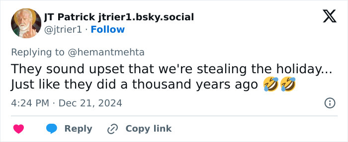 Tweet discussing holiday traditions amid Christian and atheist groups' Christmas billboard debate.