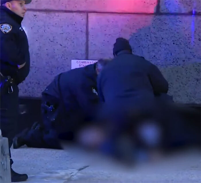 Police officers responding at a crime scene related to Brian Thompson&rsquo;s homicide amid public reactions.