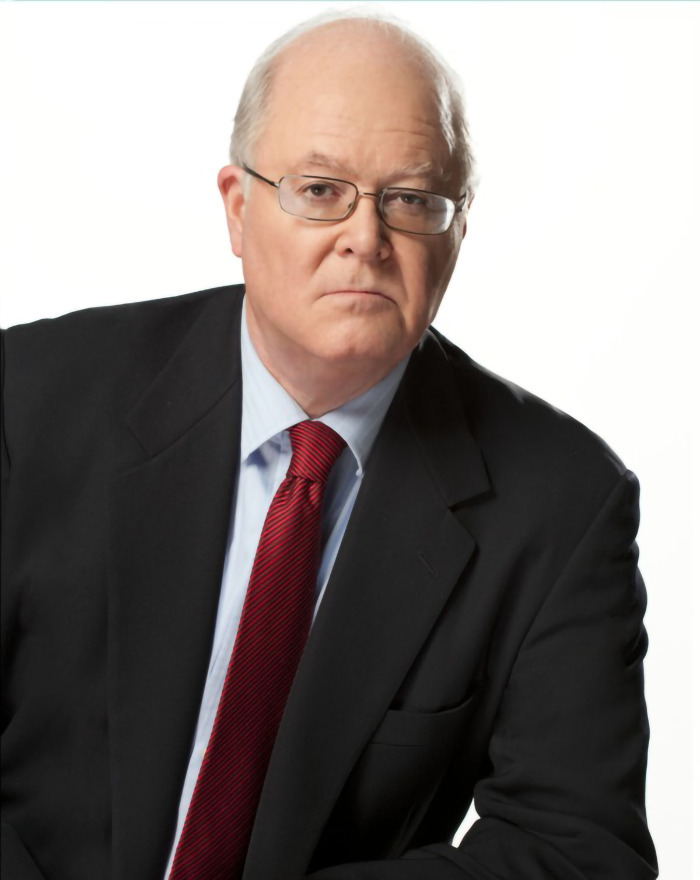 Bill Donohue in a suit and red tie.