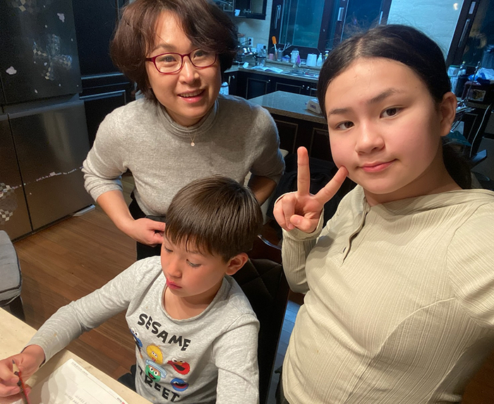Family moment in the kitchen with "BBC Dad" kids, now grown up.
