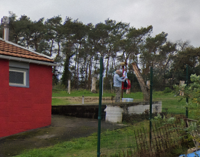 Paulette Landrieux husband Marcel Taret standing outside near a red building with trees in the background, captured on Google Maps, relates to woman vanishing incident.