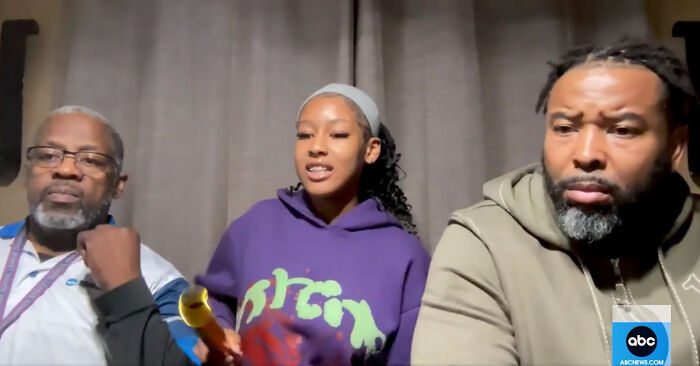 Runner shares video to prove innocence, sitting with two men during an interview.