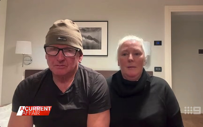 Couple discussing their traumatic experience on a flight, sitting in a room.