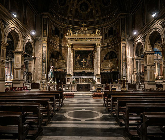 Church interior with empty pews, highlighting religious architecture, related to holiday billboard discussions.