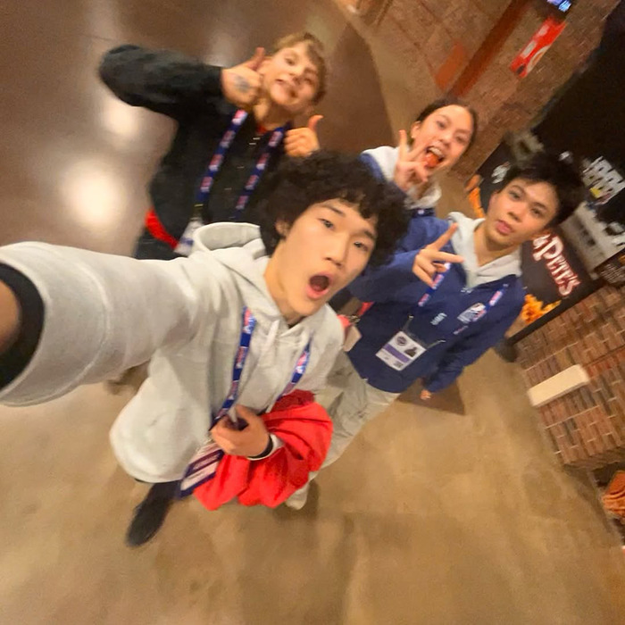 Teen skaters smiling together indoors, capturing a heartfelt moment before tragedy.