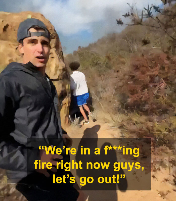 Young men filming near fire in La Palisades area.