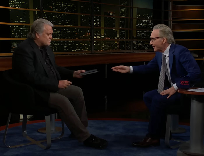 Two men in a TV studio discussing Trump's potential third term paths.