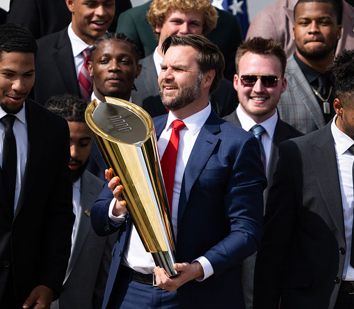 &ldquo;Keep Them Down&rdquo;: Trump Pulls Absurd Stunt To Look Taller Than Towering Ohio State Football Team