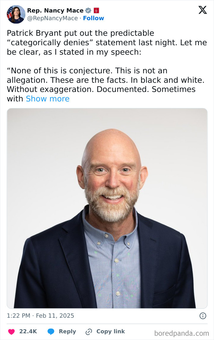 Alt text: Patrick Bryant in a suit smiling during a statement about Nancy Mace showing a naked image of herself in a House hearing.