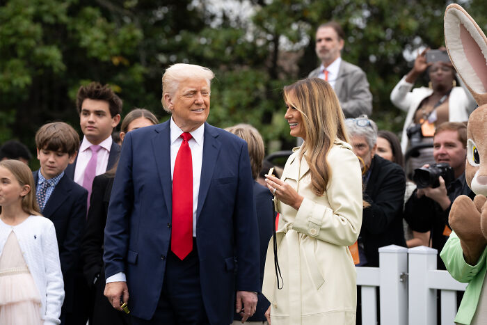 Donald Trump and Melania Trump attending an outdoor event, reflecting their separated marriage and unique relationship norms.