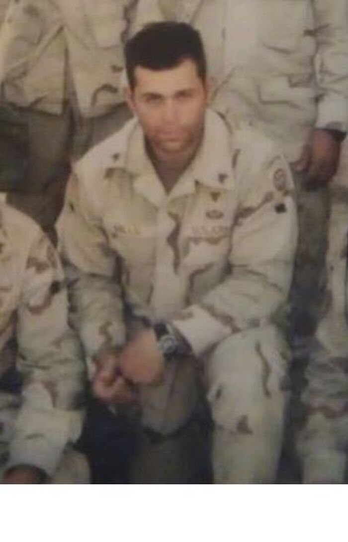 Man in military uniform posing for group photo, related to Republican accused of lying about military service and Bronze Star.