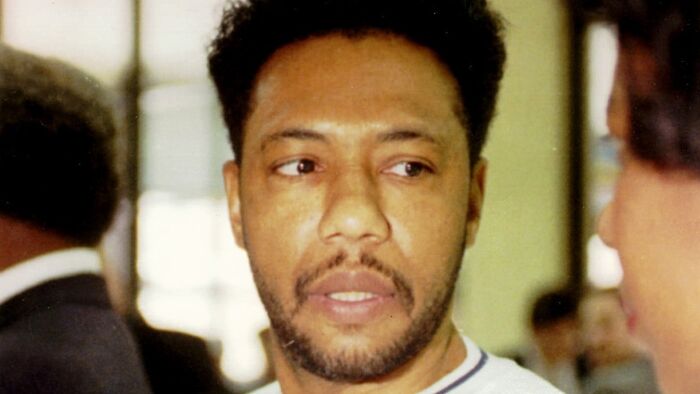 Larry Hoover in a close-up image with a serious expression related to Trump commuting his sentence after celebrity support.