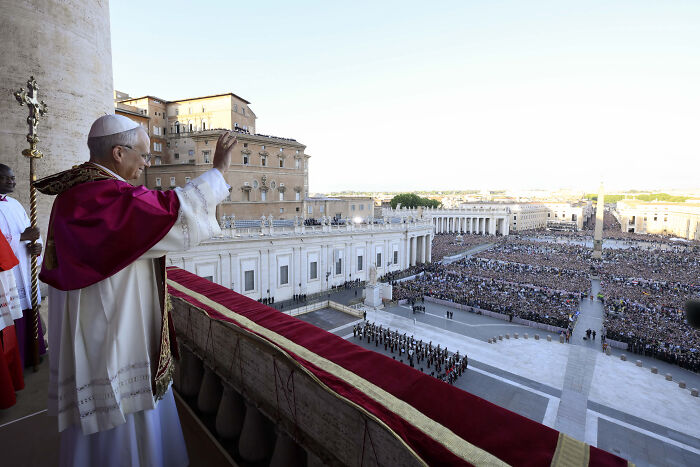 New Pope Leo XIV addressing a large crowd overlooking child abuse claims at former Chicago parish.