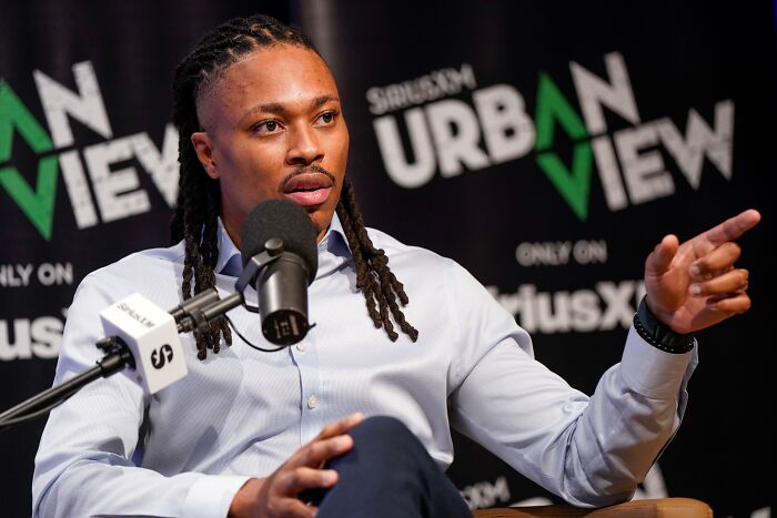 Man speaking into microphone during SiriusXM Urban View show, discussing DNC committee vote on Democratic vice chair.