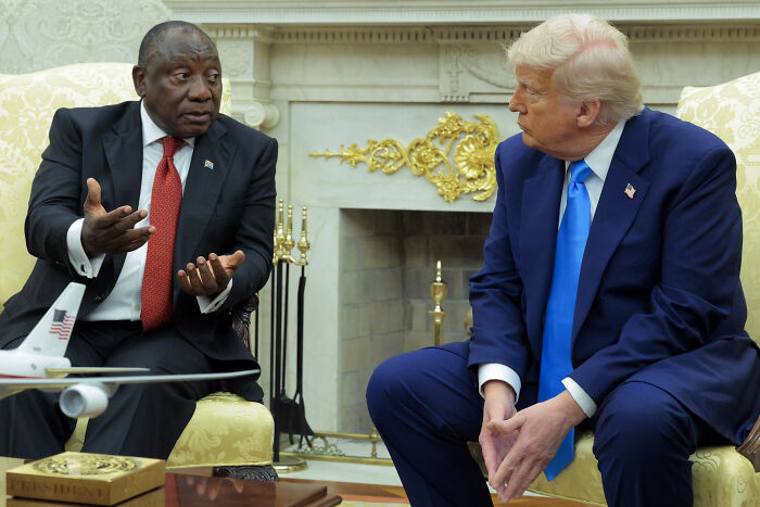 Donald Trump and South African President seated and talking in formal setting, related to white genocide discussion.