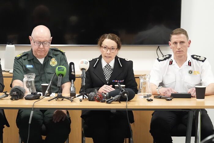 Police officials addressing fans vandalizing suspect&rsquo;s car before it plows into Liverpool FC parade at a press conference.
