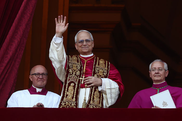 Robert Prevost in traditional papal robes waving from balcony as JD Vance reacts to election and anti-Trump posts re-emerging