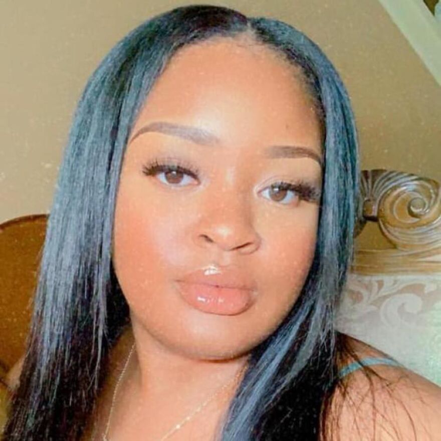 Young woman with long black hair and glossy lips, representing brain-dead pregnant woman kept alive due to Georgia abortion ban.