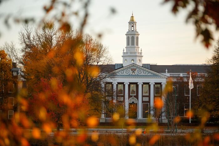 Historic government building in autumn, symbolizing U.S. government resuming foreign student visas with social media access demand