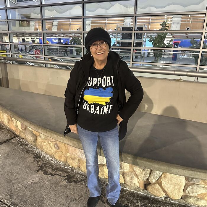 Woman wearing glasses and a black beanie standing outdoors, related to Trump proposed pardon Jan 6 rioter MAGA Granny.