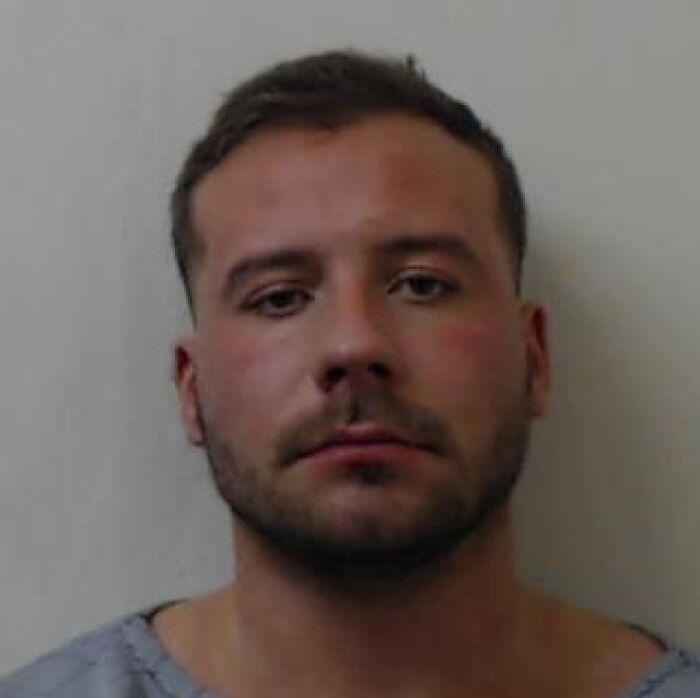 Mugshot of a man linked to a case involving accessed porn 170 times while covering up girlfriend's murder and beheading.