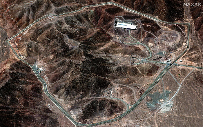 Satellite image showing Iran's nuclear site terrain amid tensions over potential U.S. nuclear strikes and retaliation threats.