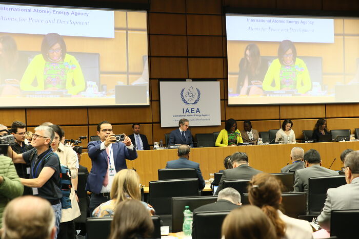 Crowds calmly gathered on rooftops as blazing rockets soar toward Israel in bizarre moments of conflict celebration.