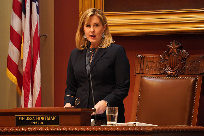 Melissa Hortman speaking at the podium in the legislative chamber during a session on lawmakers&rsquo; attack investigation.