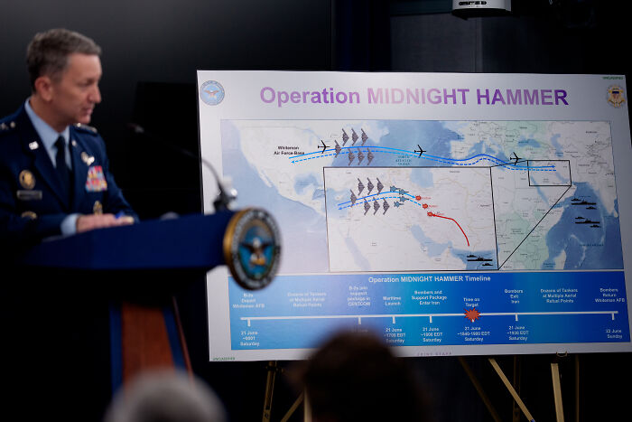 U.S. military official presenting Operation Midnight Hammer map outlining planned Iran strikes and target locations.