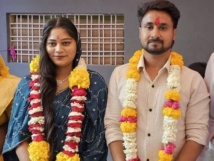 Bride and groom wearing traditional garlands, related to missing bride surrendering to police after alleged husband murder.