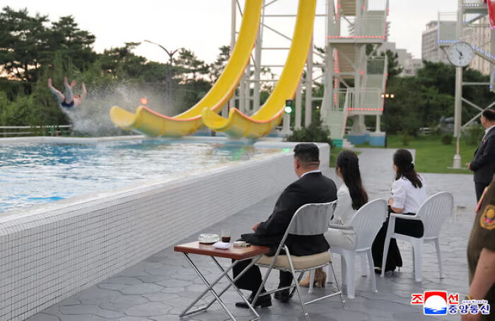 North Korea beach resort opening with Kim Jong Un observing water slides as tourism revival efforts take place.