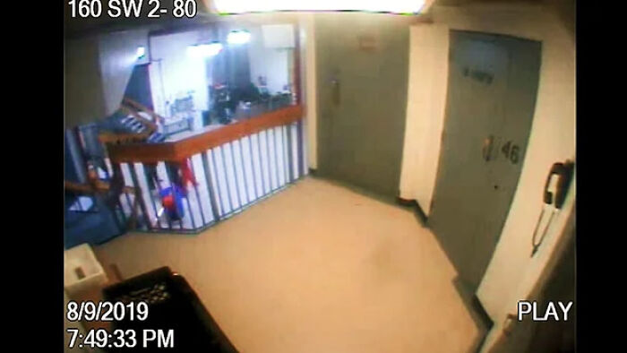 Surveillance footage of jail hallway showing an orange figure near cell area before Jeffrey Epstein&rsquo;s death.