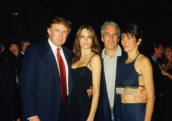 Donald Trump and Jeffrey Epstein posing together at a formal event with two women, related to Epstein files report.