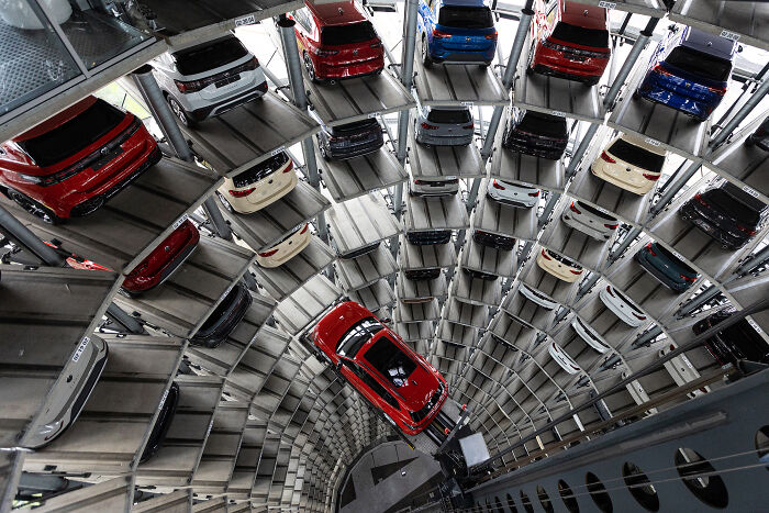Multi-level parking garage filled with European cars, illustrating potential impact of new tariffs on car affordability.