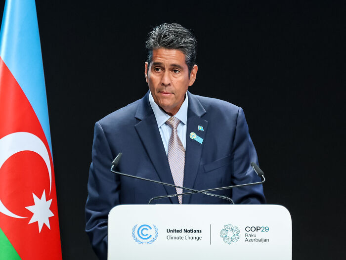 Speaker at United Nations Climate Change event in Baku addressing immigration and asylum seekers as global bargaining chips.