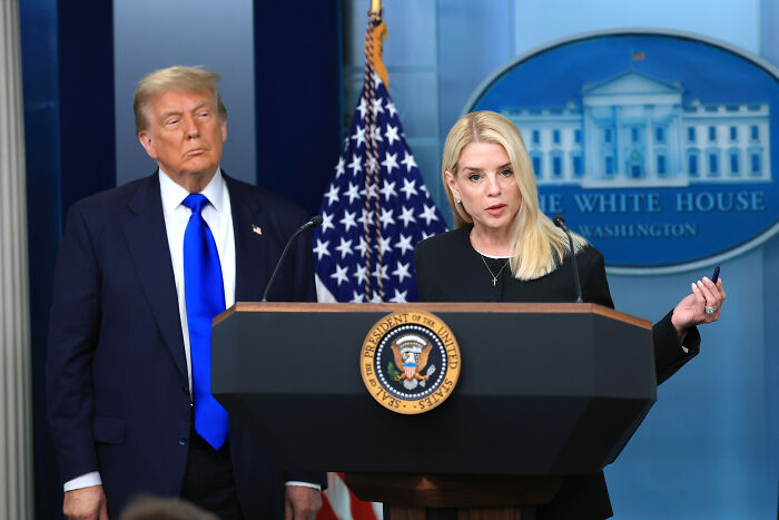 Former President Trump and a spokesperson at a White House press briefing on DOJ and FBI statements about Jeffrey Epstein.