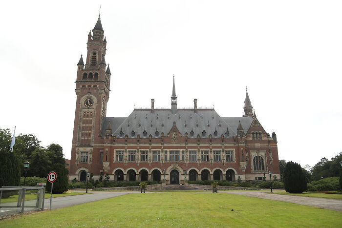 The International Court of Justice building with a clock tower, related to countries suing over climate change cases.