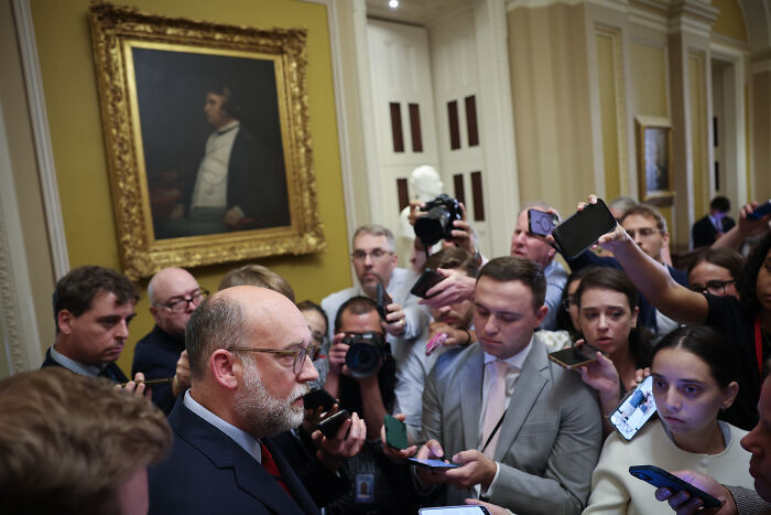 Senate member speaking to reporters amid media coverage as foreign aid and public broadcasting cuts move to the House.