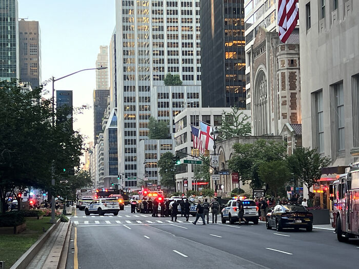 Police and emergency vehicles block a New York City street after the New York shooter incident involving NYPD officers.