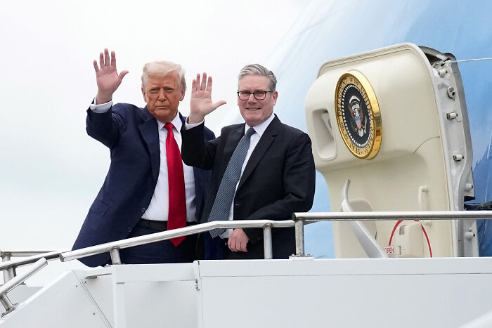 Donald Trump and Keir Starmer waving from Air Force One during a press briefing with London mayor references.