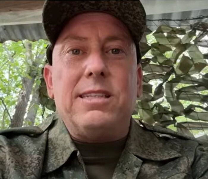 Man in military uniform outdoors, representing dad of three sent to front lines in Putin&rsquo;s Ukraine war.