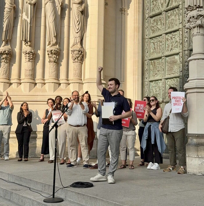 Activist Mahmoud Khalil speaking at rally demanding accountability in $20M Trump claim after ICE detention.