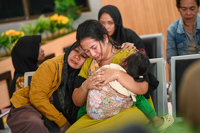 Relatives mourn as dozens go missing after ferry carrying 65 passengers sinks near Indonesia&rsquo;s Bali in a waiting area.