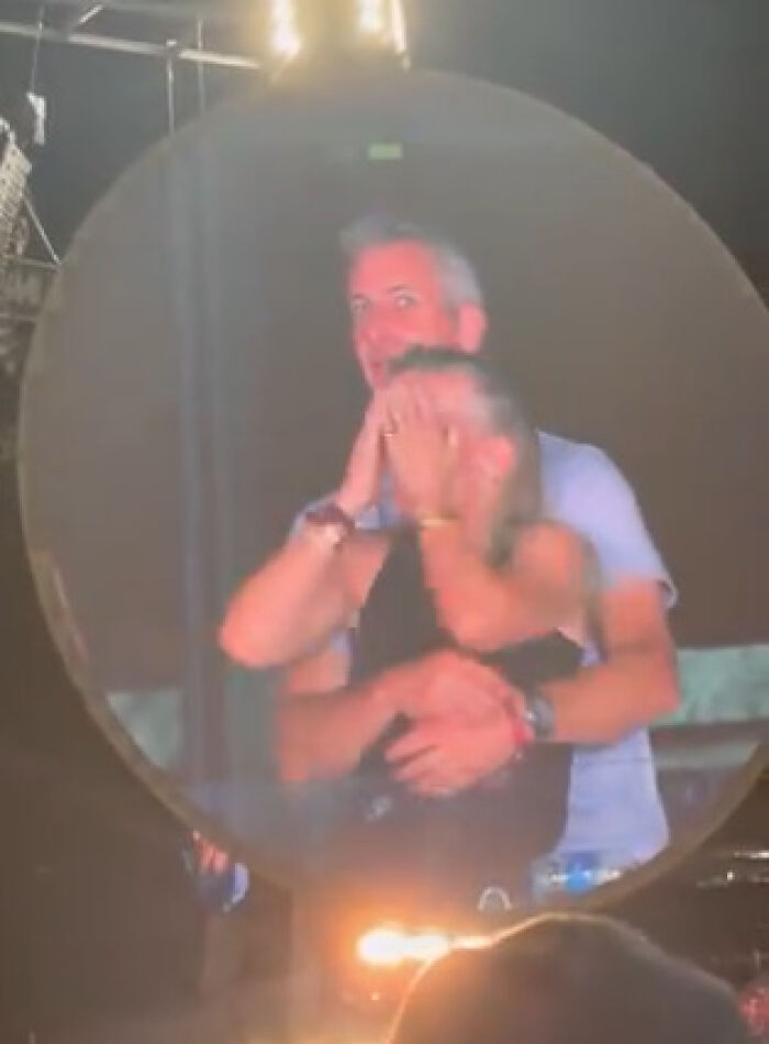 Two people embracing at night, highlighting the Coldplay CEO drama and public privacy concerns.