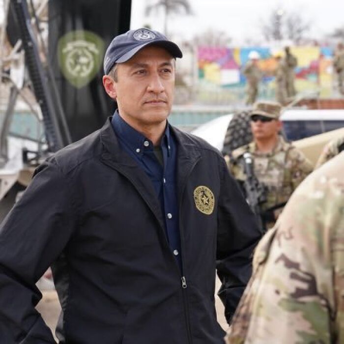 Man in black jacket and navy cap at military base, related to pro-life Republican accused of paying for abortions.