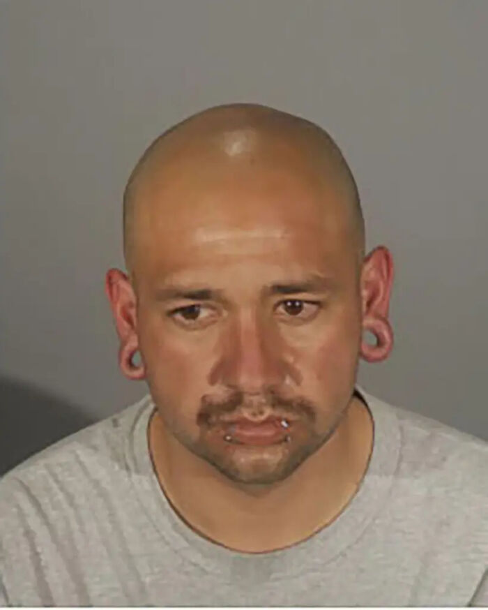 Mugshot of man arrested by police accused of shooting driver who rammed into crowd outside L.A. club.