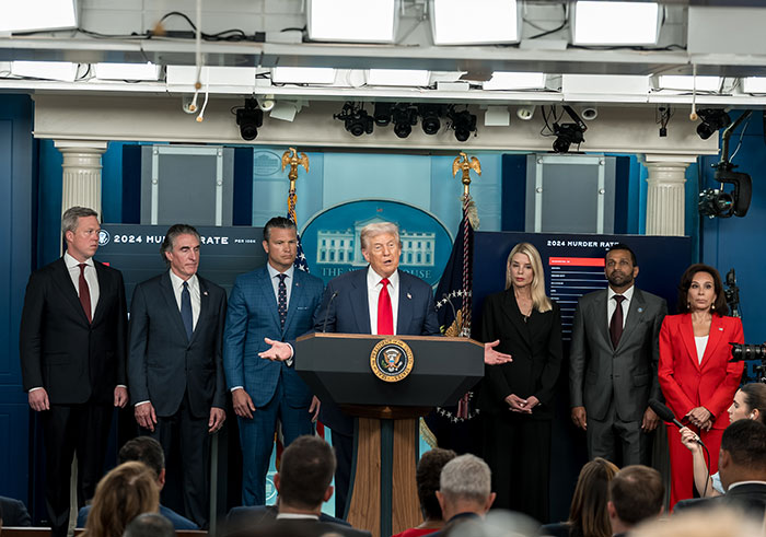 Former President Trump speaking at a press conference with aides, addressing political issues amid 2024 campaign discussions.