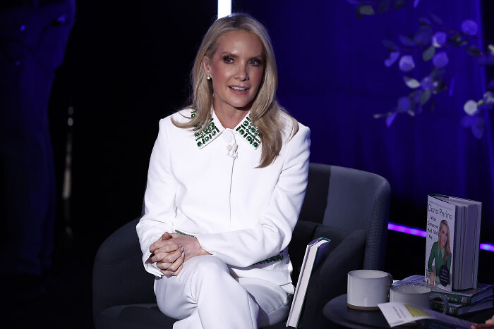 Dana Perino seated in white outfit during a televised discussion, related to Fox News and Gavin Newsom posts controversy.