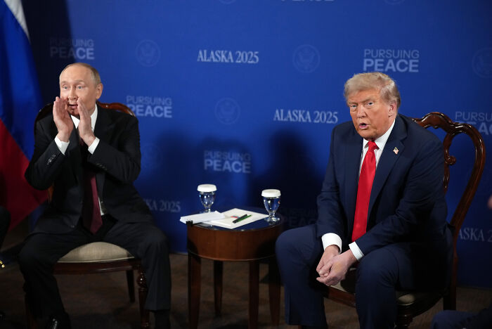 Donald Trump seated in a discussion emphasizing Ukraine war could end almost immediately with actions from Zelenskyy.
